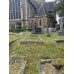 Tombstone, cemetery in London, circular cross, solar disc